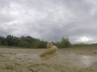 Blowing Bubbles Under Mud On A Rainy Day Part 1 free video